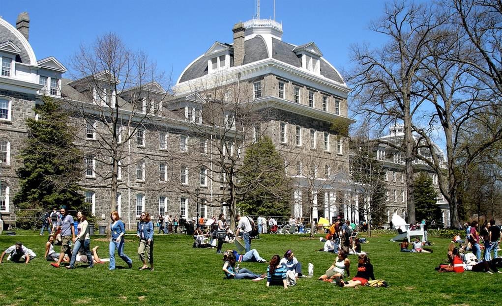 swarthmore college campus with students on the lawn.