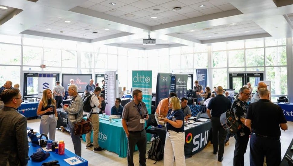 IT and web professionals mingle at a conference.
