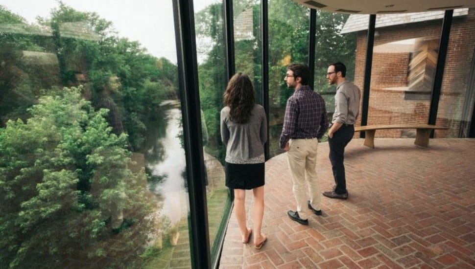 Several visitors overlooking the greenery at Brandywine Conservancy and Museum of Art.