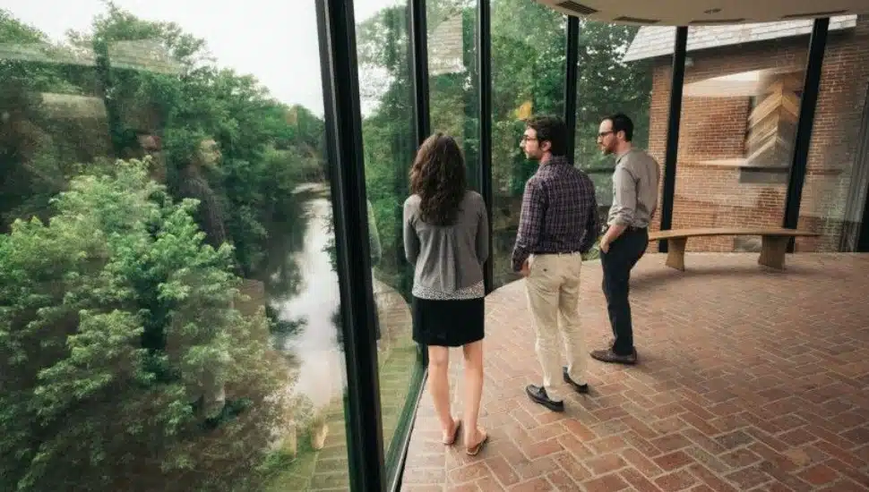 Several visitors overlooking the greenery at Brandywine Conservancy and Museum of Art.