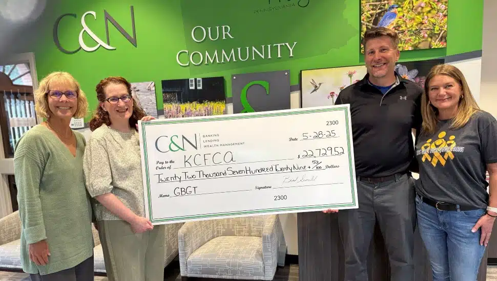 Group photo of a check donation.
