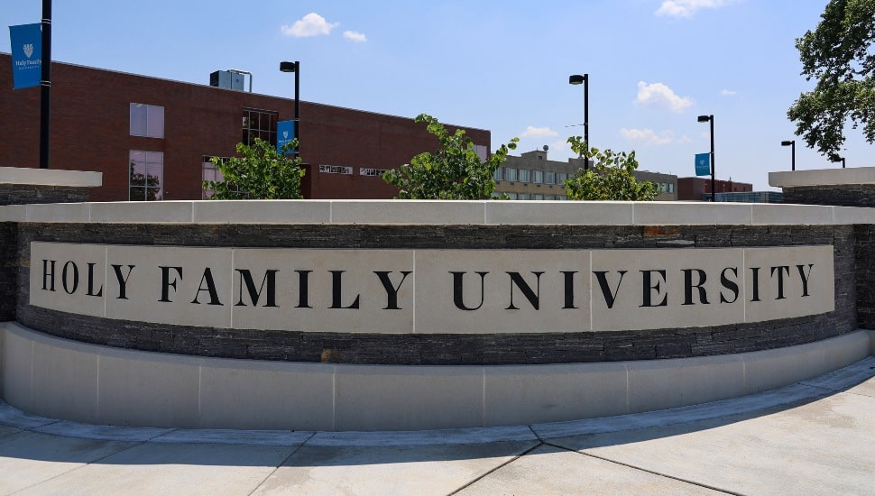 Entrance to college campus with signage.