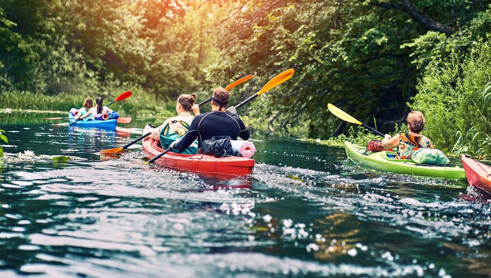 A group of people on a kayak outing.