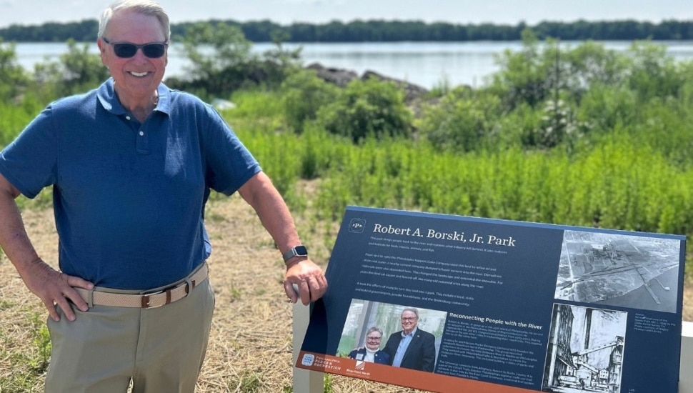 Robert A. Borski Jr. with a sign of the park named after him.