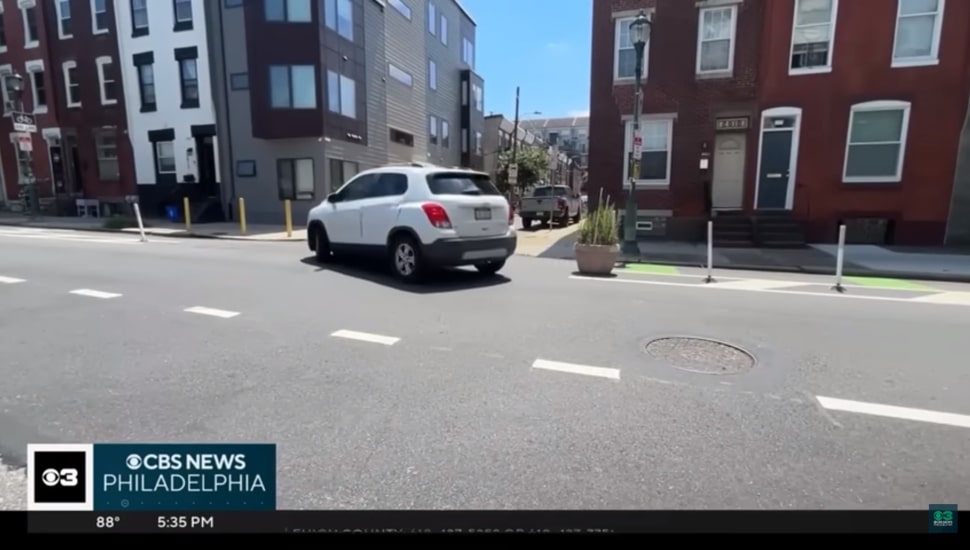 Car driving through intersection.