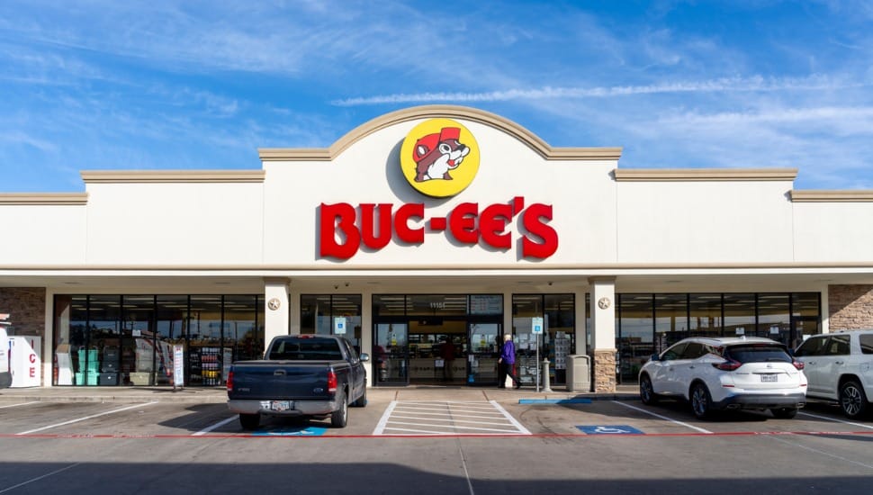 Buc-ee's store with cars in parking lot.