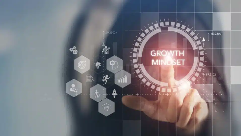 A person engages with a digital interface growth mindset concept.