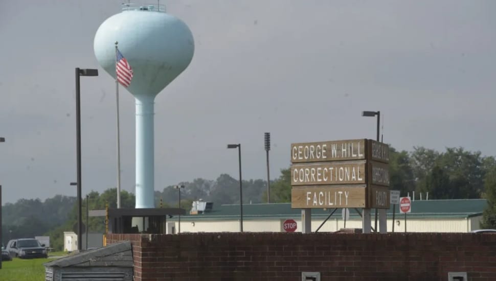 Prison with water tower in view.