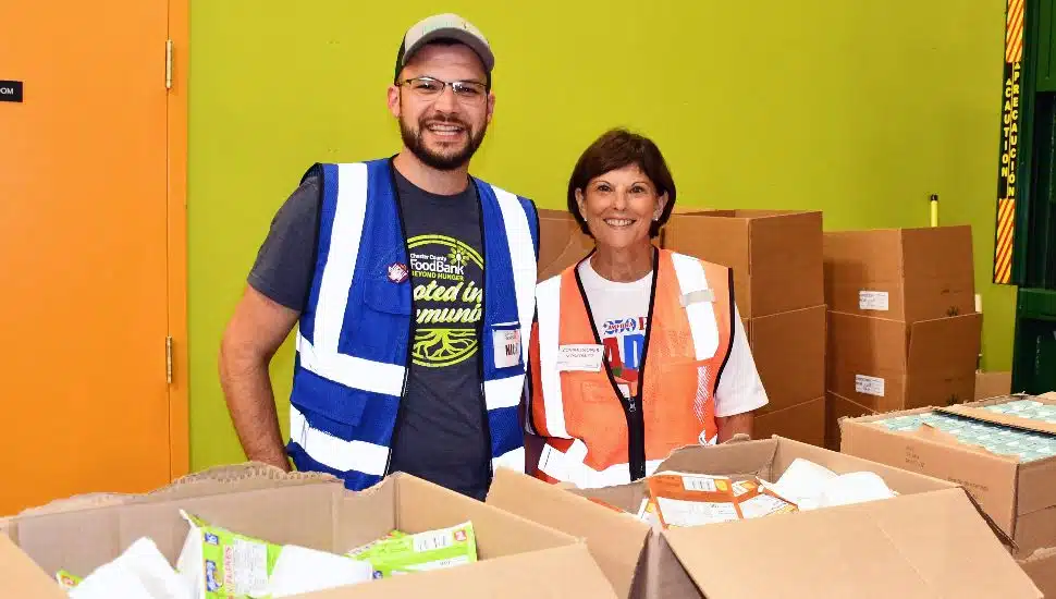 Chester County Commissioner Marian Moskowitz volunteering at the Chester County Food Bank with Nick Imbesi of the Chester County Food Bank.