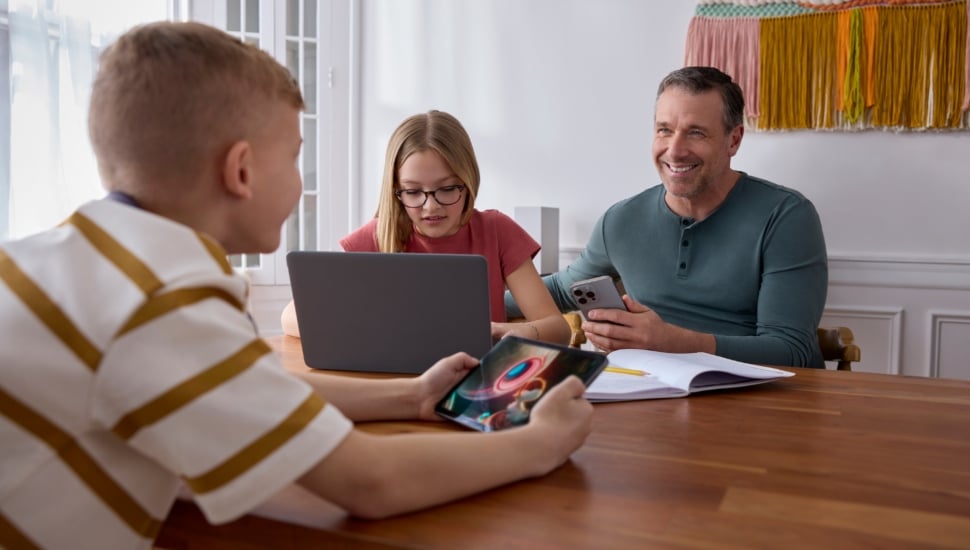 Comcast internet customers sitting at table.