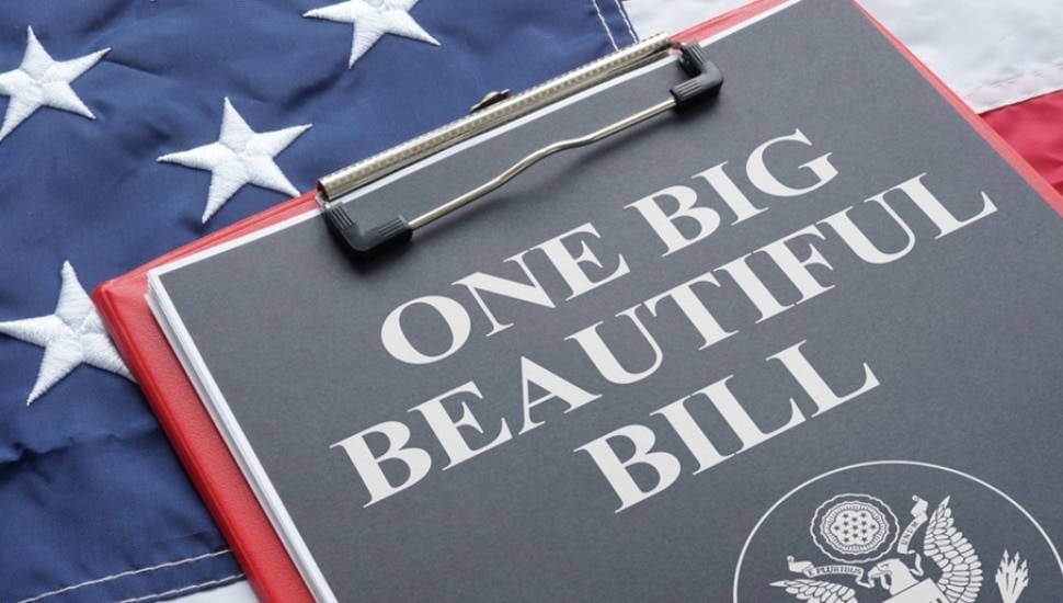 Clipboard that says One Big Beautiful Bill Act on top of American flag.