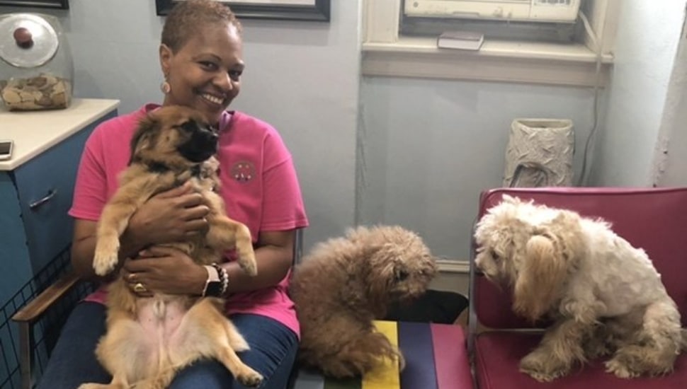 Kathleen Wells with three dogs.