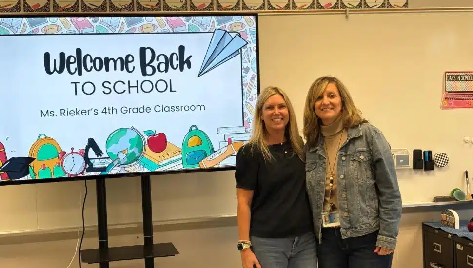 Two teachers with a "welcome back to school" presentation at the new Octorara Intermediate School.