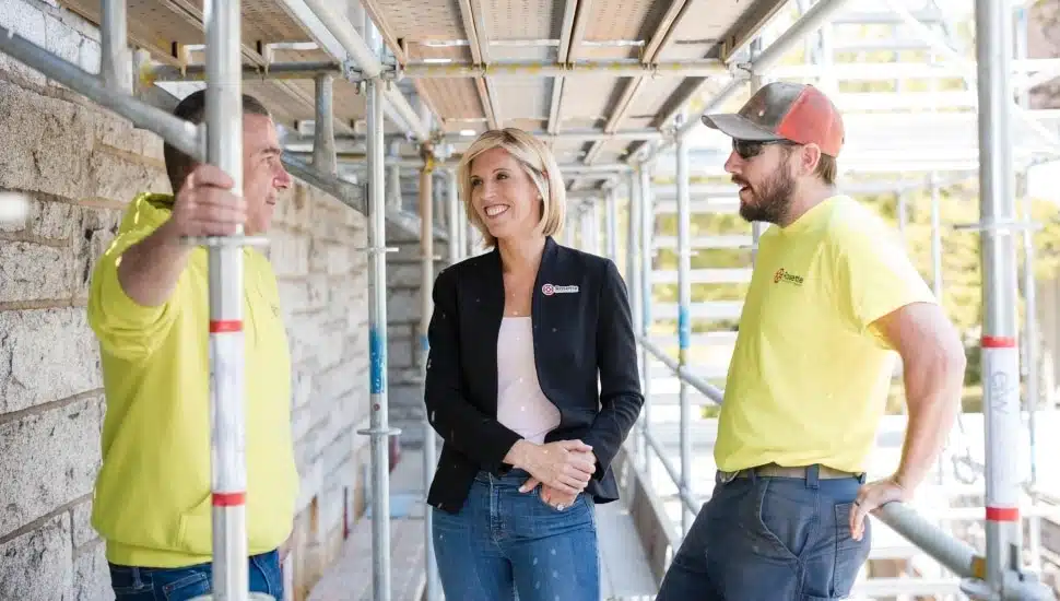 Rosemary Connors, center, with two workers.