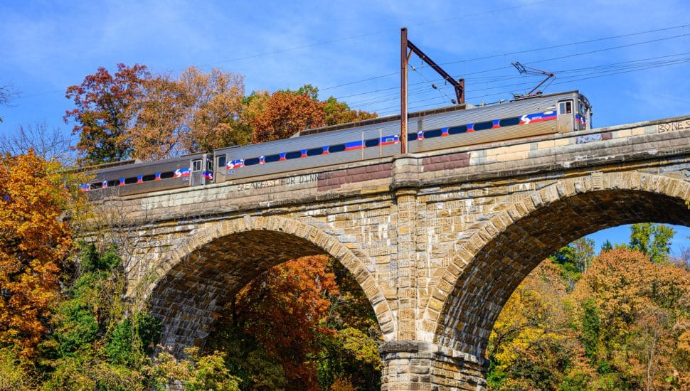 SEPTA train on a rock bridge.