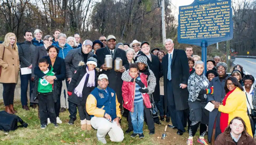 Group of Coatesville communities members at Zachariah Walker historical marker.