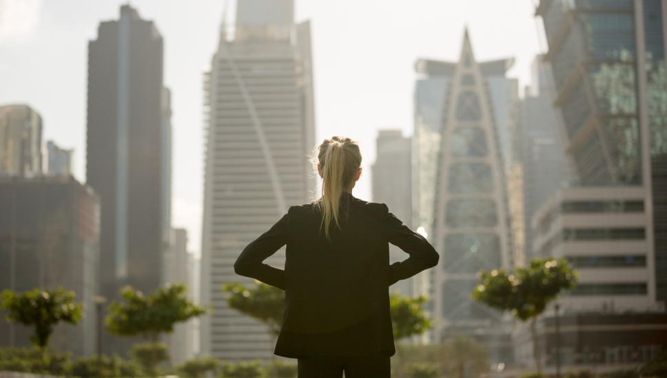 Woman staring at city skyline.