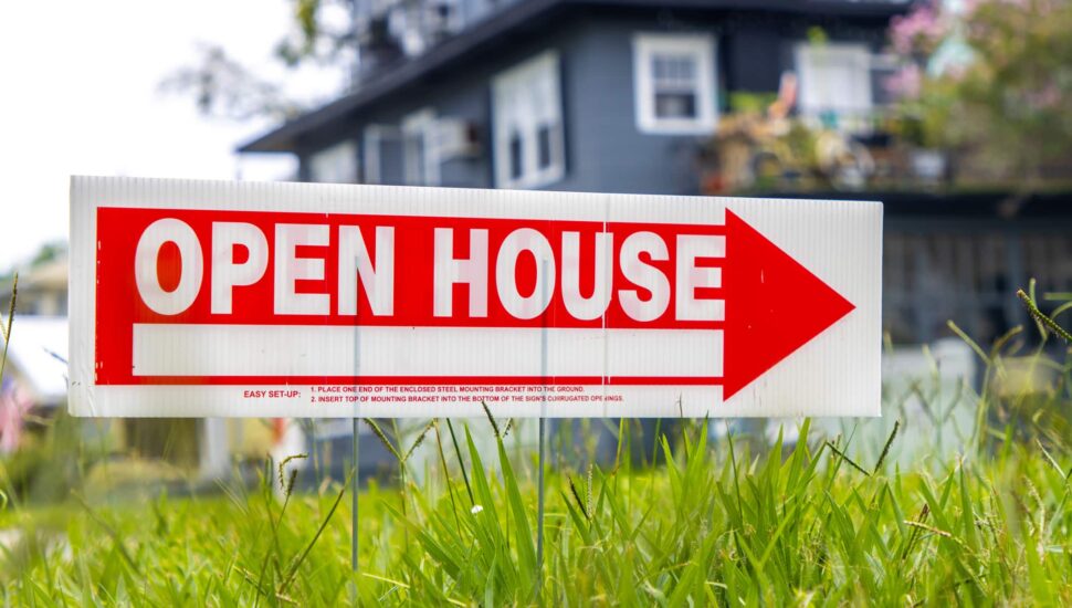 Open House sign on lawn.