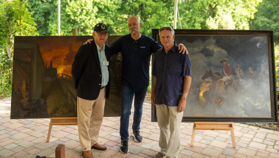 Adrian Martinez with Bruce Mowday and Mark Slouf.