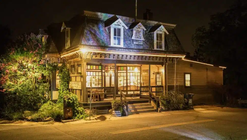Birchrunville Store Cafe exterior at night.
