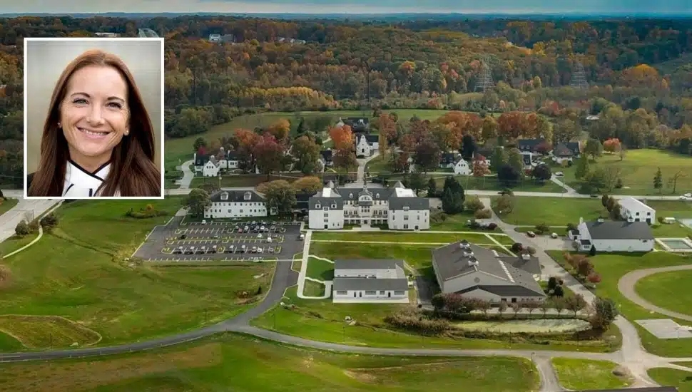 Aerial view of rural boarding school with middle-aged woman's headshot inset.
