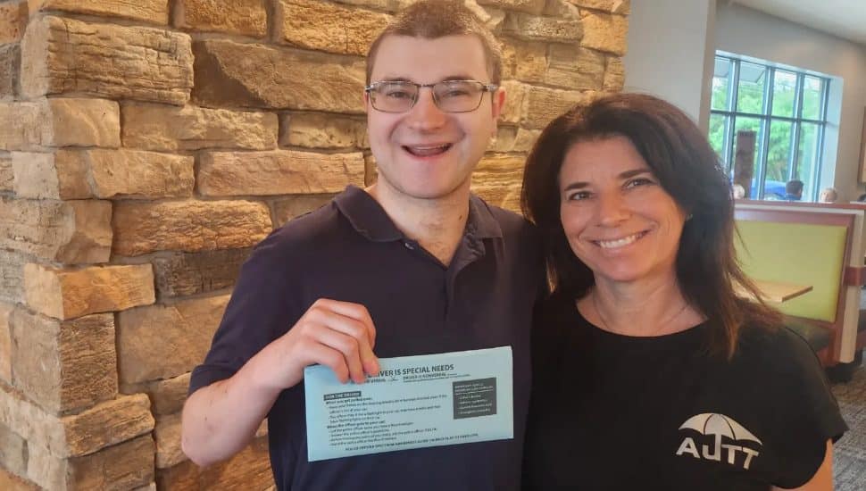 A local resident with a blue envelope as a part of the Blue Envelope program.