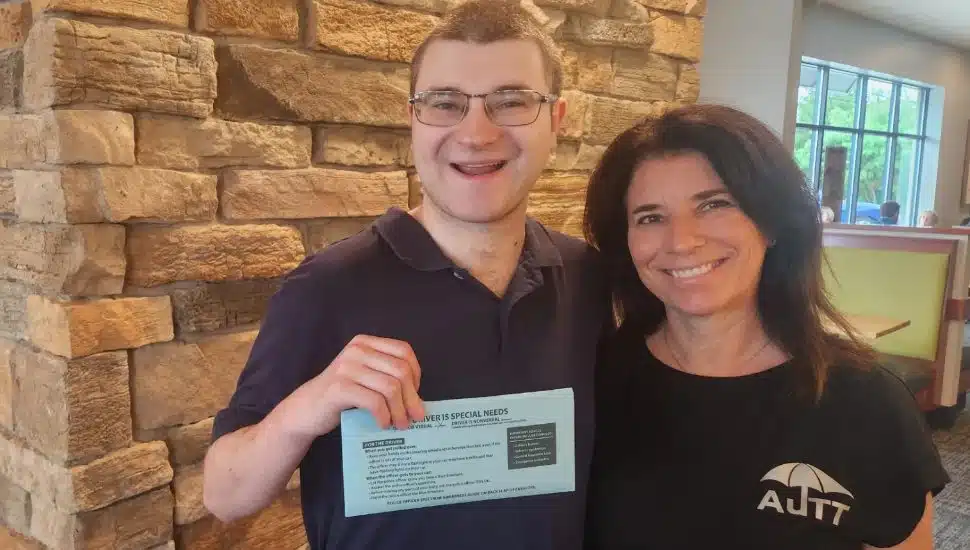 A local resident with a blue envelope as a part of the Blue Envelope program.