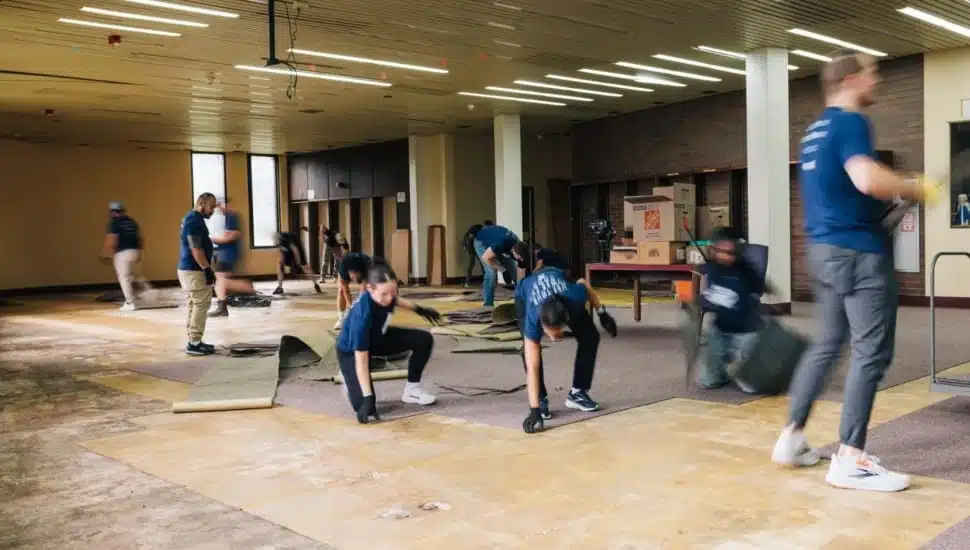 Employees working on renovating a building.