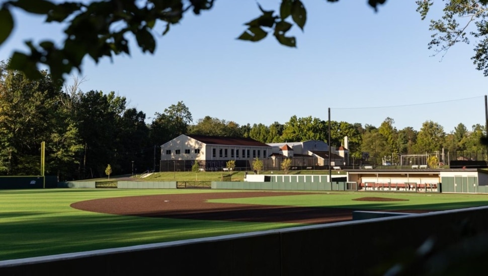 Turf baseball field on college campus.