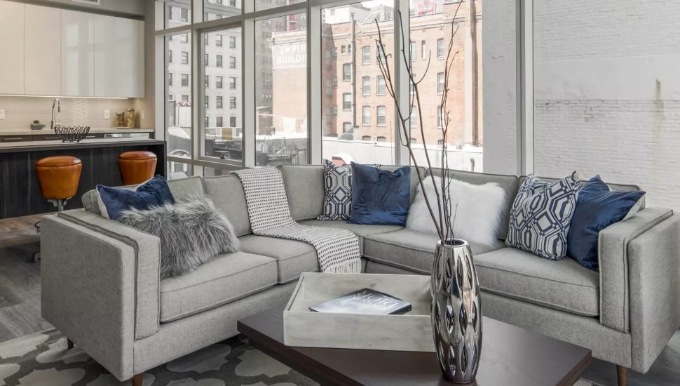 Living room and kitchen at apartment complex.