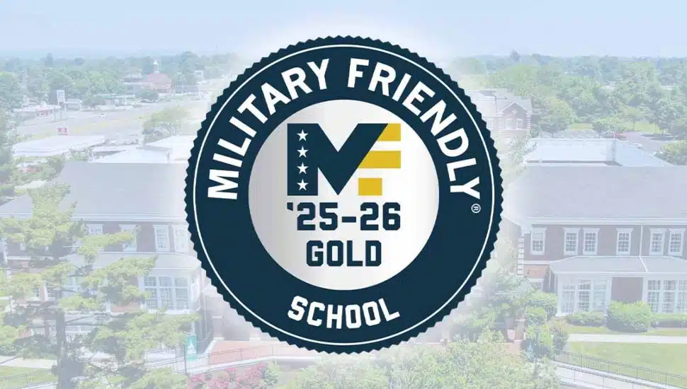 Military Friendly School 2025–2026 Gold-Level badge displayed over a Wilmington University campus background.