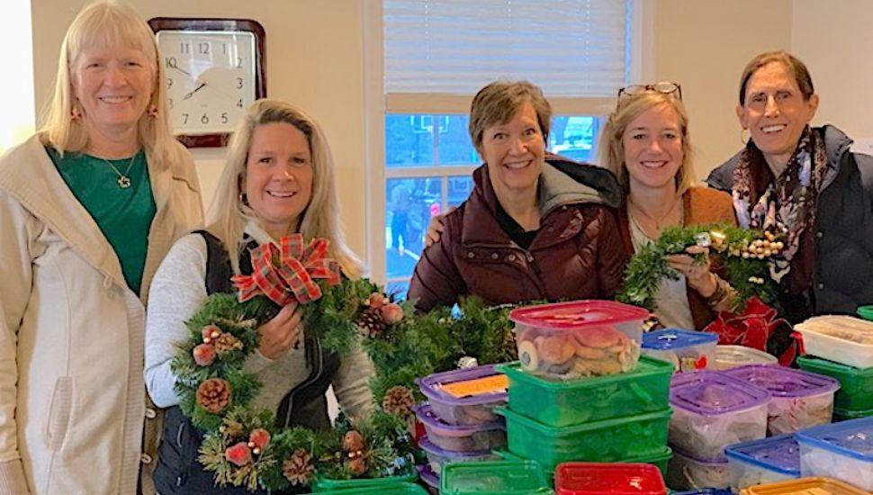 Sandi Gorman, at left, with T&E Care team members at a 2019 Holiday Drive.