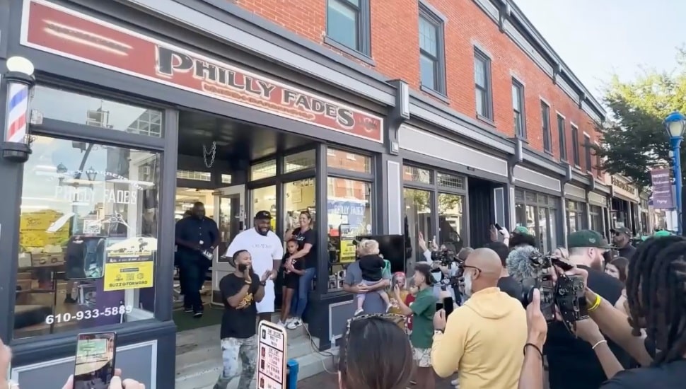 Former Eagle Brandon Graham and a surrounding crowd at Philly Fade's Buzz It Forward event.
