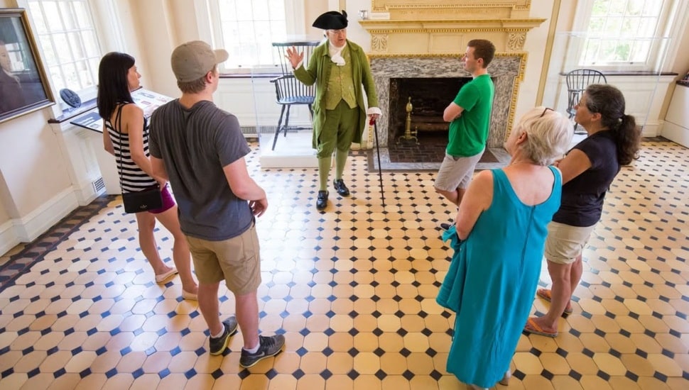 People in Carpenter's Hall with an actor.