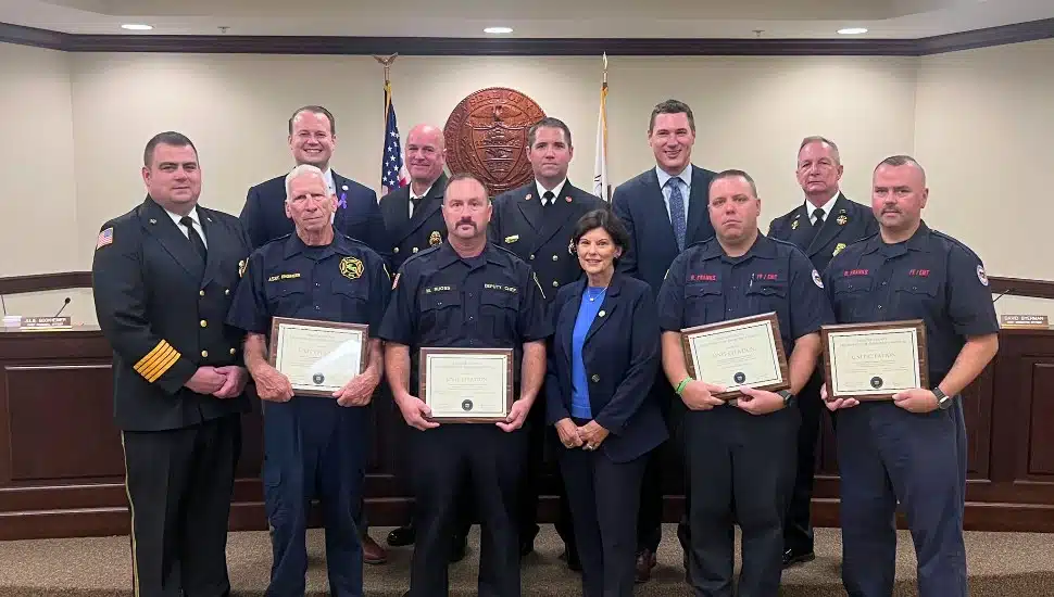 A team of local firefighters receiving the William H. "Pop" Winters award.