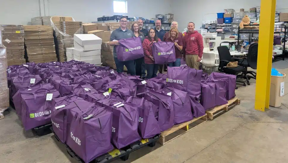 Volunteers pack donation bags at a nonprofit.