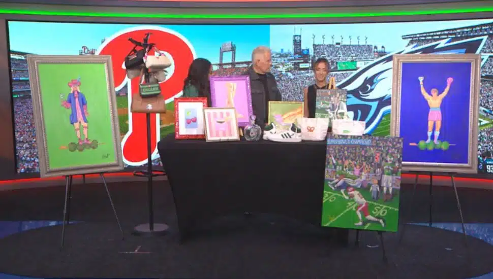 Callie Avellino on FOX29 with anchors and her art pieces.