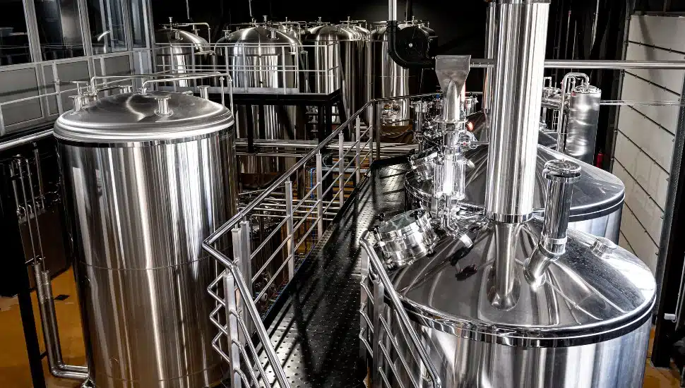 Craft beer brewing equipment in brewery.