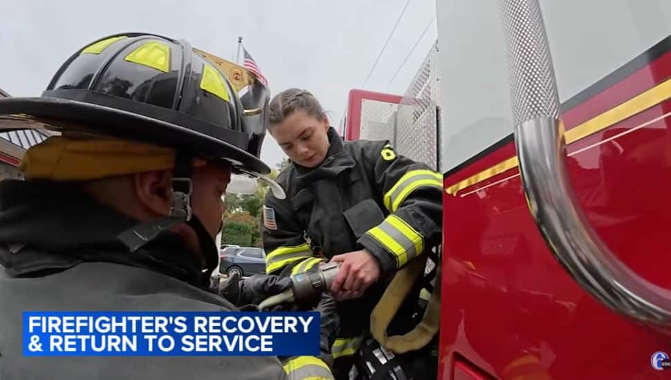 Emily Gindele in training with another firefighter.