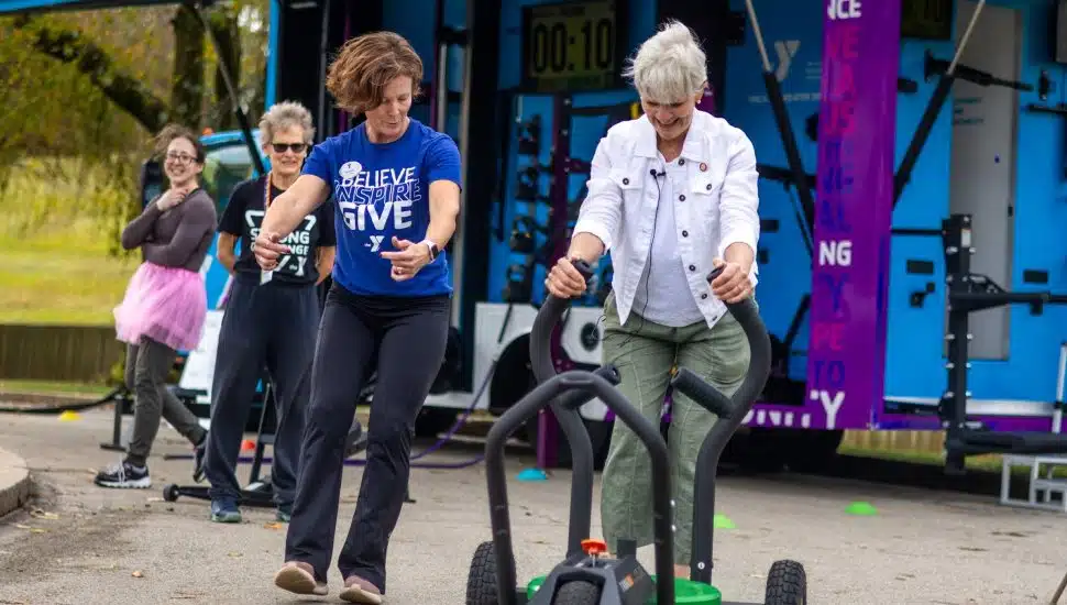 Senator Carolyn Comitta works with Wellness staff from the YMCA of Greater Brandywine to demonstrate fitness equipment as part of a Senior Health Fair.