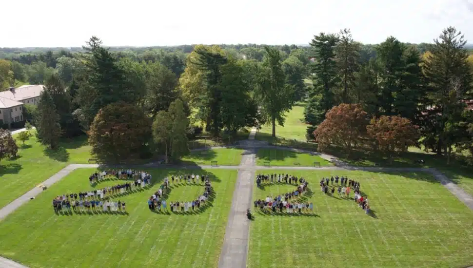 Students standing in formation on a large grassy lawn at Immaculata University, arranged to form the numbers “2029,” representing the incoming class.