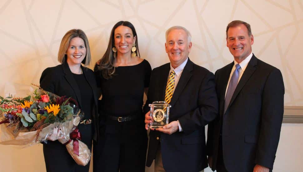 Jack Lynch receiving award with CCCBI people.