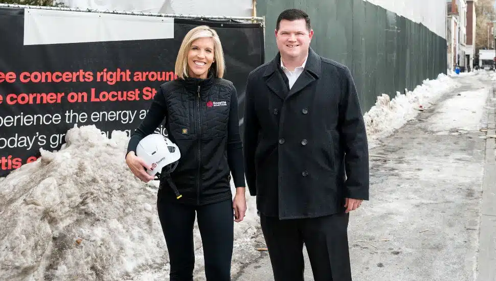 Rosemary Connors, Founder of Rosette Specialty Trades stands at construction site.