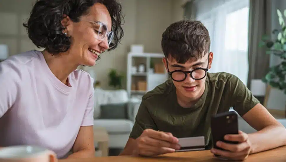 Mother teaches her son about credit.