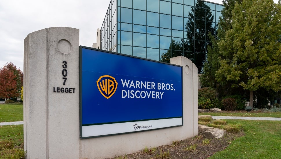 Warner Bros Discovery signage outside.
