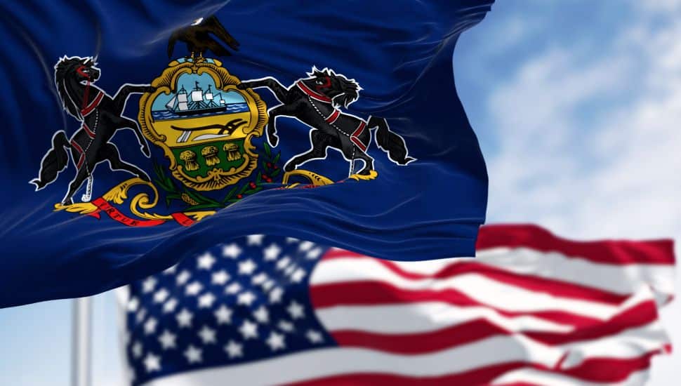 PA state flag and American flag.