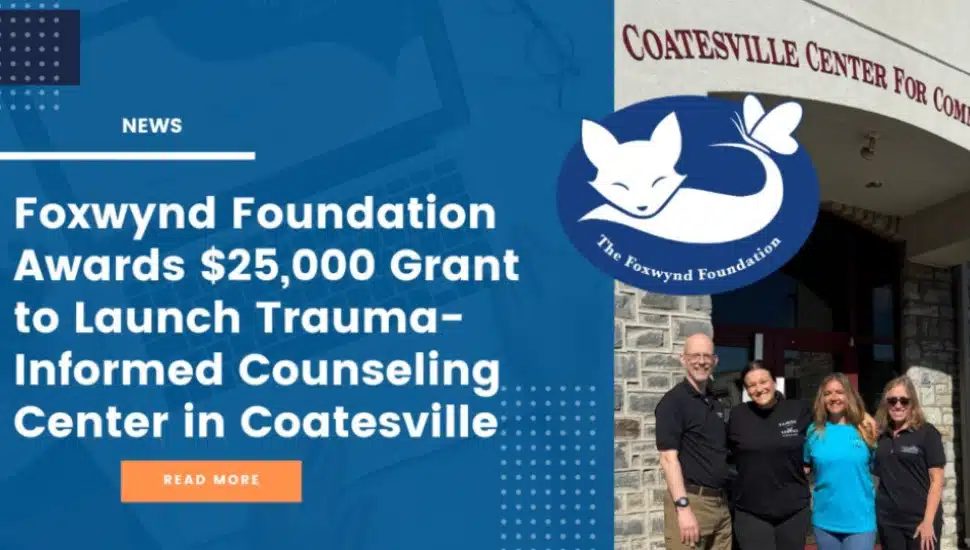 A poster announcing the Foxwynd Foundation $25,000 grant with three women and a man standing in front of the entrance to the Coatesville Counseling Center.