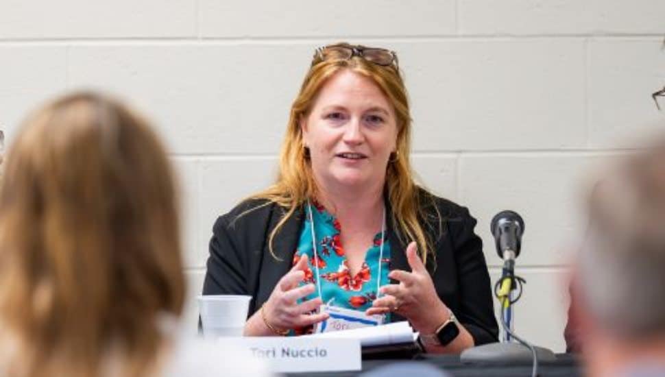 Portrait or feature image of Dr. Tori Nuccio, West Chester University’s deputy director of financial aid, who received PASSHE’s Keepers of the Flame Award for her leadership in equity, access, and student support.