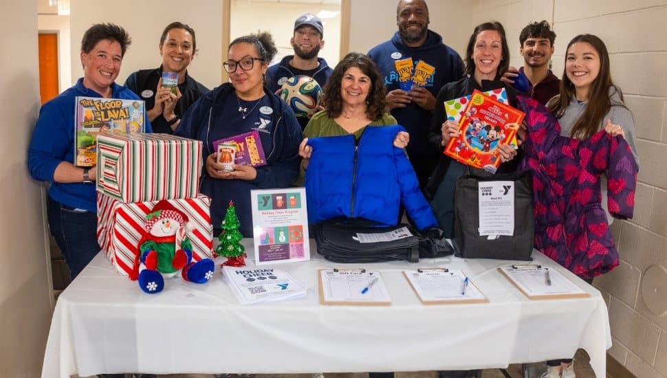 Staff Members of the Oscar Lasko YMCA and Association Office gather items for Holiday Cheer at the YMCA of Greater Brandywine. Left to right: Katie Doochack, Laura Mackiewicz, Lizette Herrera, Mike Ellis, Helene Greenstein, Christian Christopher, Rebecca Fremont, Spencer Abrams, Autumn Golden.