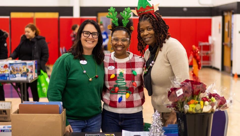 Staff at the Coatesville YMCA greet members and guests during the Holiday Cheer event on Dec. 4.